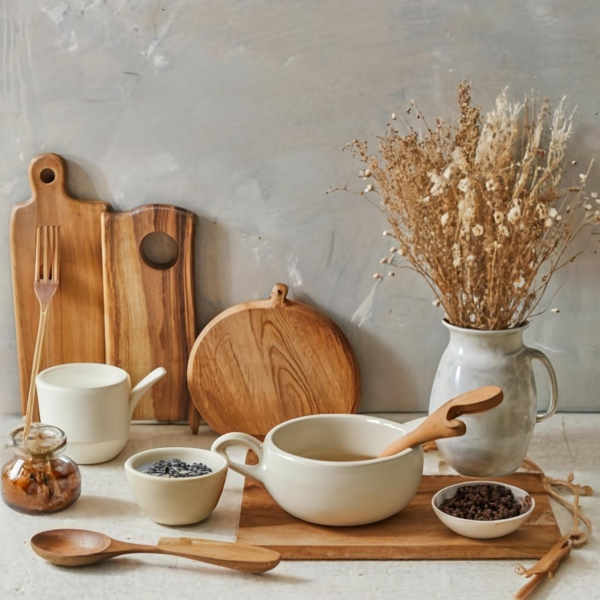 Warm kitchen interior with wooden table and utensils